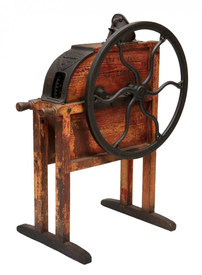 MOUNTVILLE PONY IRON & WOOD CORN SHELLER: Mountville Pony corn sheller No. 17, Mountville, Pa., late 19th c., wood and cast iron, crank operated, 26.5" fly wheel, carry handles at one end, worn red paint, 42.5"h, 23", 36"d **Provenance: "Mesq