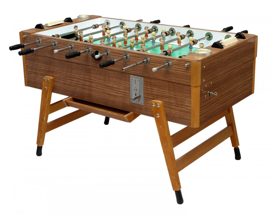 FOOSBALL TABLE SOCCER GAME: Foosball table soccer game, originally coin operated but now balls return without coins, two pucks, 22 balls, rectangular with angular legs, 35.25"h, 55.5"l, 29.25"d, longest rod, 49.5"l Start Price: 