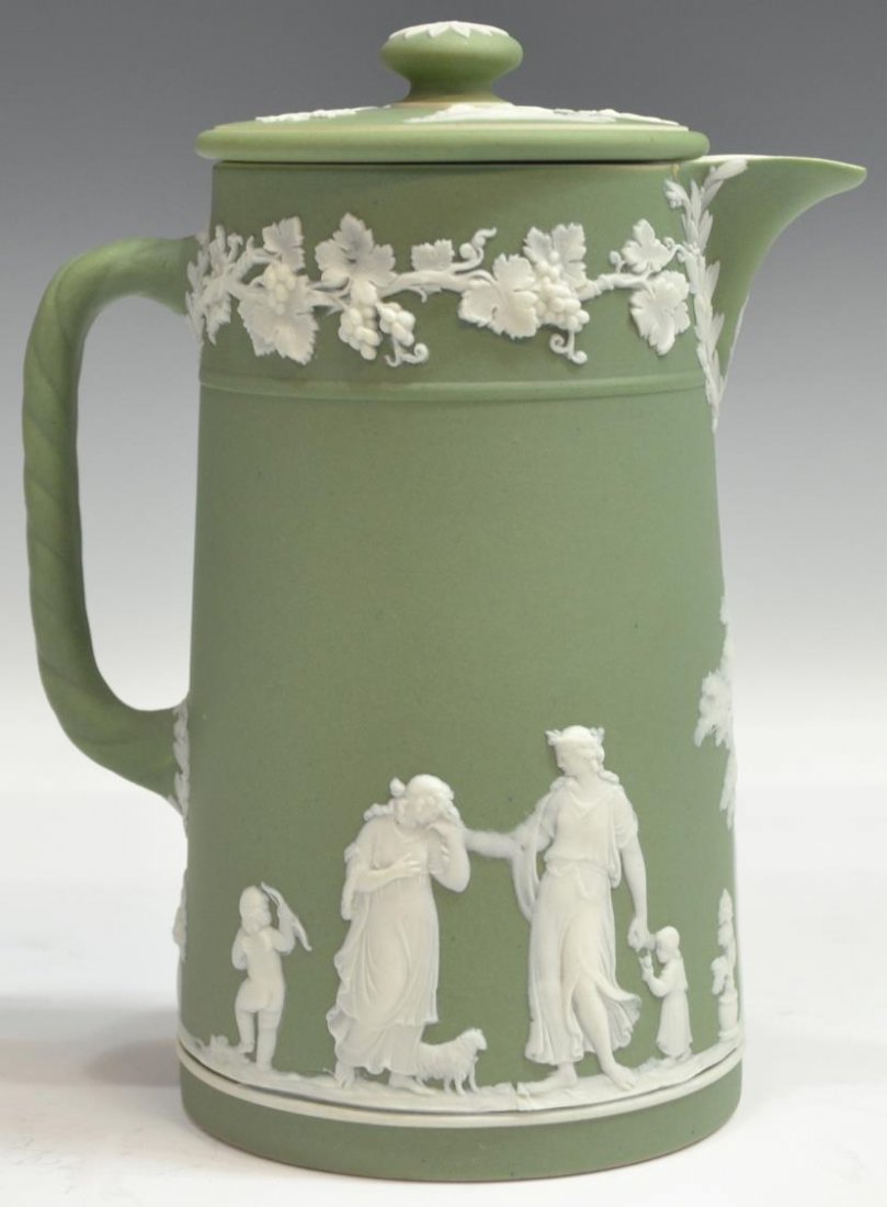 (2) WEDGWOOD JASPERWARE PITCHER & ASIAN VASE: (lot of 2) Group of table items, comprising: (1) green Wedgwood Jasperware lidded pitcher, classical figural scenes with grapevine trim, 6.5"h; (1) decorative Asian porcelain vase, reserves of dogs ch