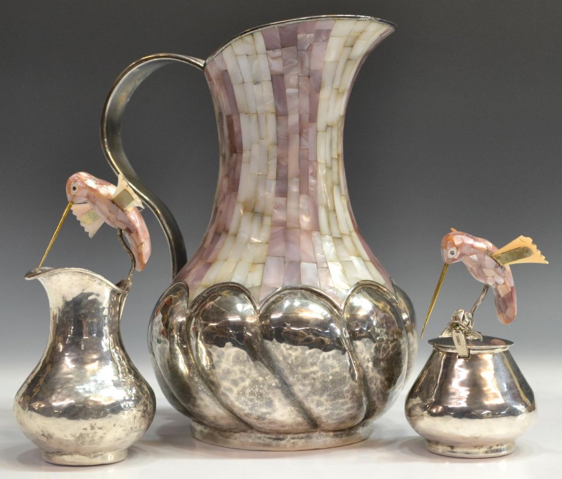 (3) LOS CASTILLOS TAXCO MEXICO SILVERPLATE & MOP: (lot of 3) Los Castillos hand hammered silver plate group, Taxco, Mexico, comprising: (1) pitcher, pink and white mother-of-pearl inlay, melon rib body, 10"w; (2) sugar and creamer, each mounted with 