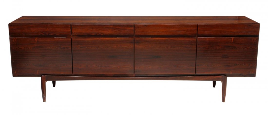 DANISH MID-CENTURY ROSEWOOD KOFOD-LARSEN SIDEBOARD: Danish mid-century modern rosewood sideboard, Ib Kofod-Larsen for Faarup Mobelfabrik, rectangular with four drawers over four doors, one door opens to six drawers, rising on tapered legs, retaining Da