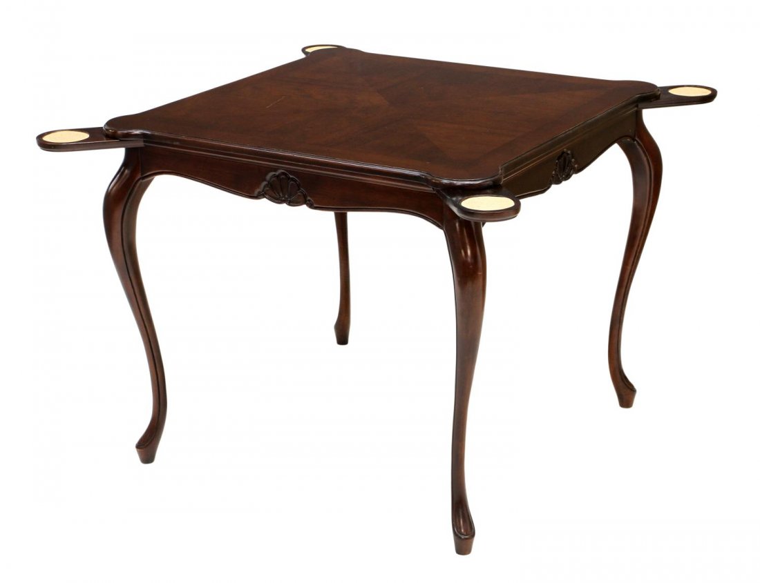 GAME / CARD TABLE IN A WALNUT FINISH: Game table in a walnut finish, a square top with protruding corners over pull out coasters, the skirt with shell decoration, rising on shaped legs with cuffed feet, scratch at top, 29"h, 33.75"w, 33.7