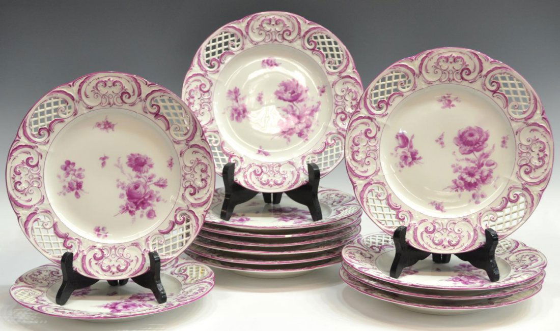 (13) KPM RETICULATED PORCELAIN SERVICE PLATES: (lot of 13) KPM reticulated porcelain service plates, decorated with raised scrollwork and floral sprigs, 9.65" diam, 8.25lbs total Start Price: $150.00