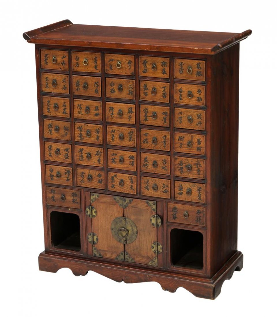 CHINESE 32 DRAWER APOTHECARY CABINET: Diminutive Chinese apothecary cabinet, the rectangular top with up turned ends over 32 drawers with incised characters, two doors and open front storage, rising on bracket feet, 32"h, 26.75"w,11.25"d 