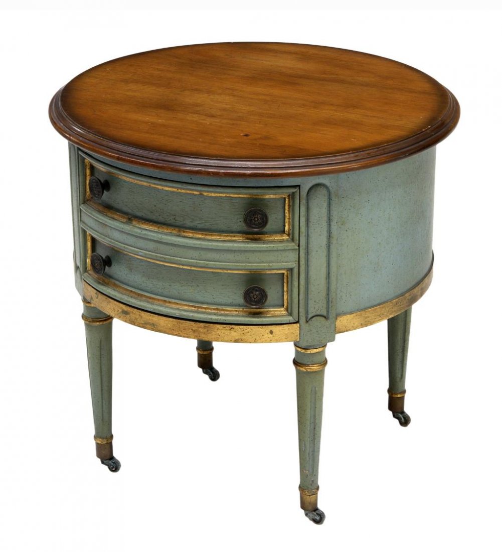 CENTURY CIRCULAR TOP DRUM TABLE: Century circular top drum table, 20 th c., green and gilt accents, the top with a natural wood finish over a single drawer, rising on tapered ribbed legs with brass caps on castors, 21.75"h, 22.75"d S