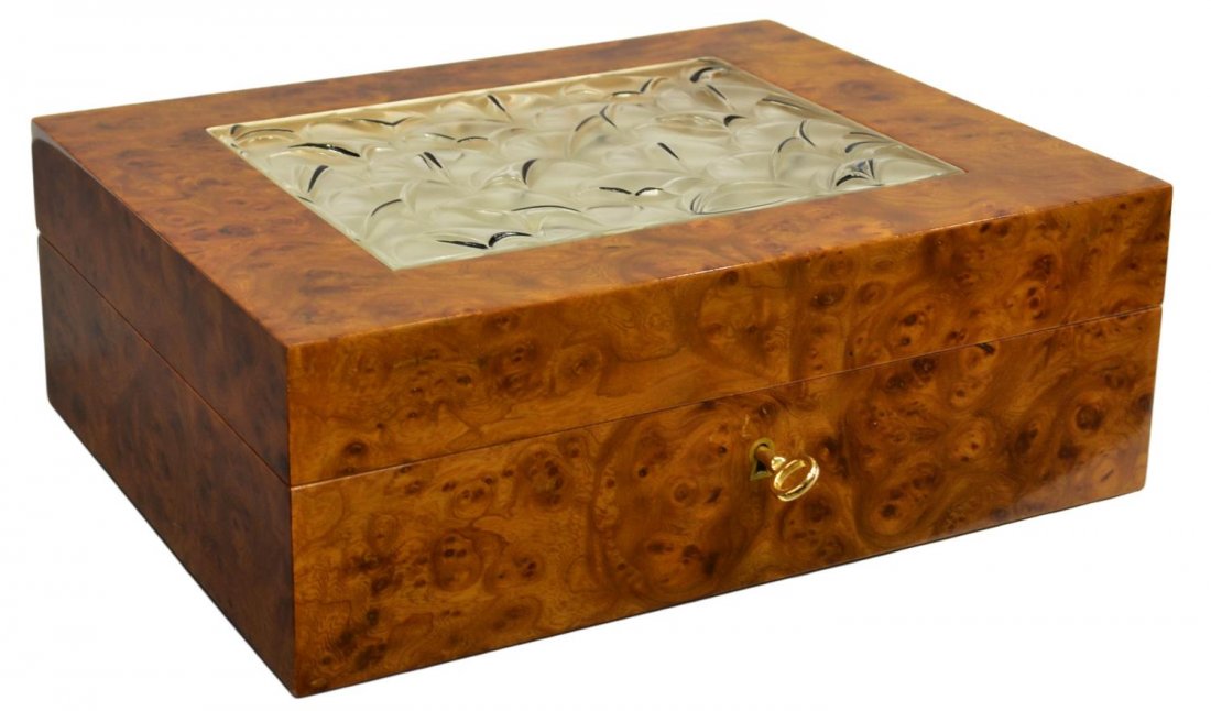 LALIQUE BURLWOOD & CRYSTAL CIGAR HUMIDOR: Lalique humidor, a rectangular burl wood case with inset Lalique crystal panel, the interior with thermometer, humidifier, two cigar cutters and makers tag, 4.1/8"h, 11.7/8"w, 9"d, 6.25lbs Start Price