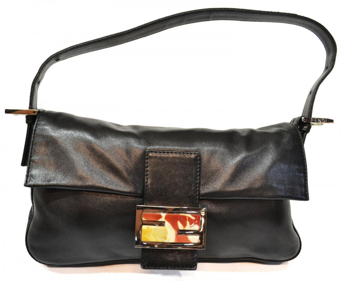 FENDI BAGUETTE BLACK LEATHER HANDBAG: Fendi 'Baguette' black leather handbag, silver tone hardware with multi-color logo at front, red liner on a single pocket interior, bag: approx 6.25"h, 10.25"w, 1"d, .75lb Start Price: $150.00