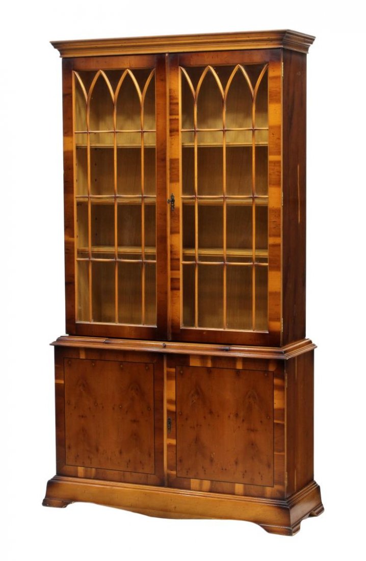 NORTHERN SPAIN INLAID GLAZED DOOR BOOKCASE: Northern Spain bookcase, the top section with a stepped cornice over two astragal faced glass doors opening to shelves, the lower section with a pull out surface above two doors having contrasting str