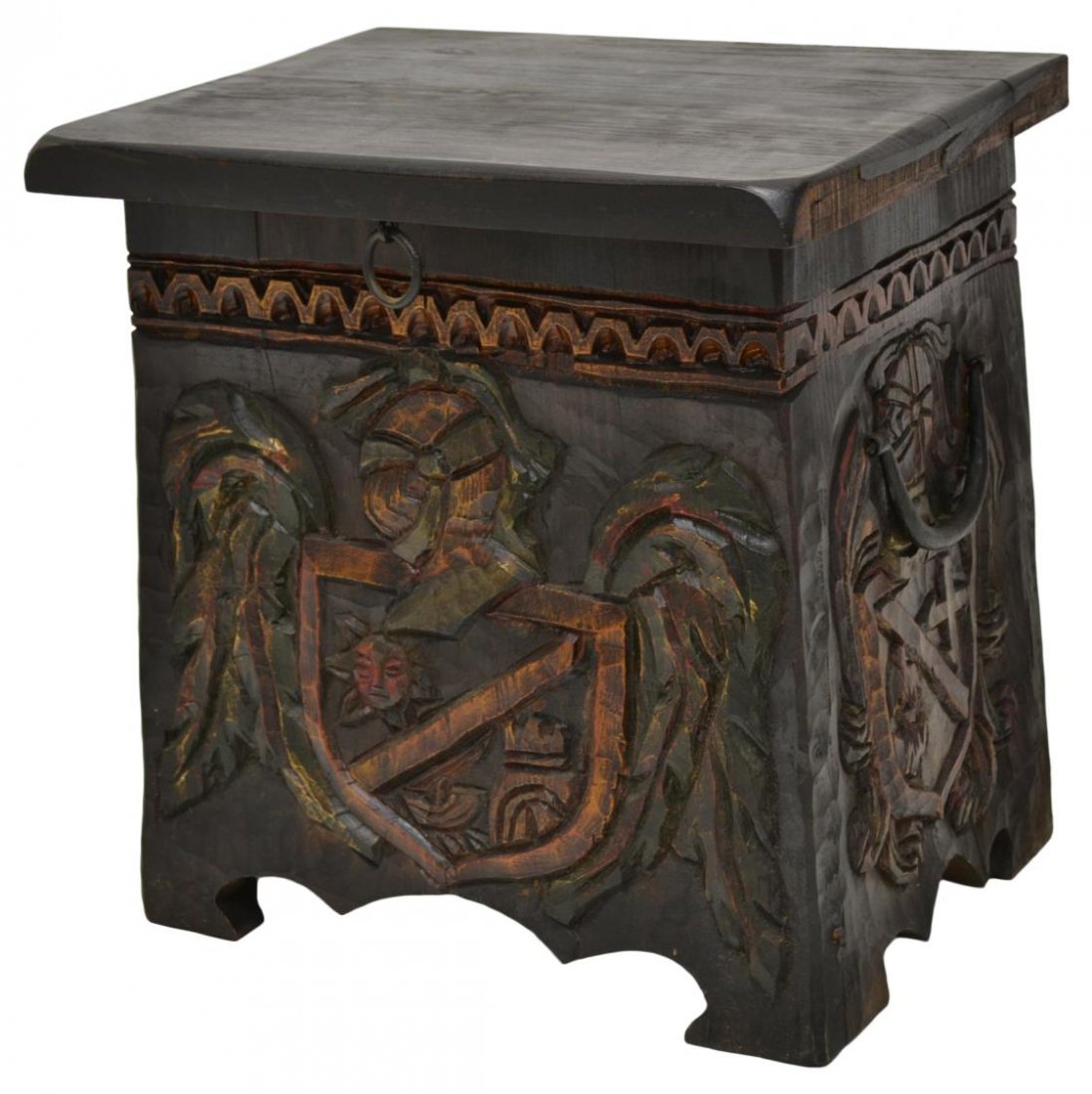 SPANISH RENAISSANCE STYLE POLYCHROME PINE BENCH: Spanish Renaissance style polychrome pine bench, a rectangular top opening to storage, front and sides carved in relief with coat of arms and foliage, iron side carrying handles, loss to wood on edges