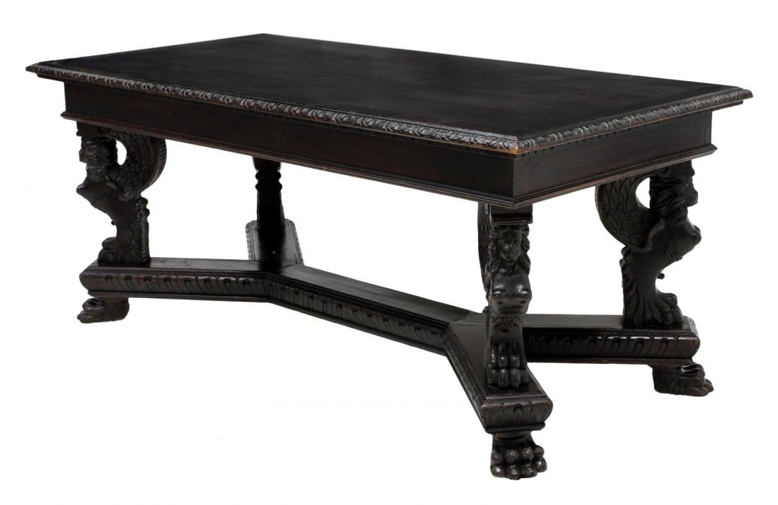 RENAISSANCE REVIVAL EBONIZED WOOD LIBRARY TABLE: Renaissance Revival ebonized wood library table, c. 1900, the rectangular top rising on four demi-figure supports joined by a carved stretcher, 31.5"h, 74.75"w, 36.25"d Start Price: $400.00