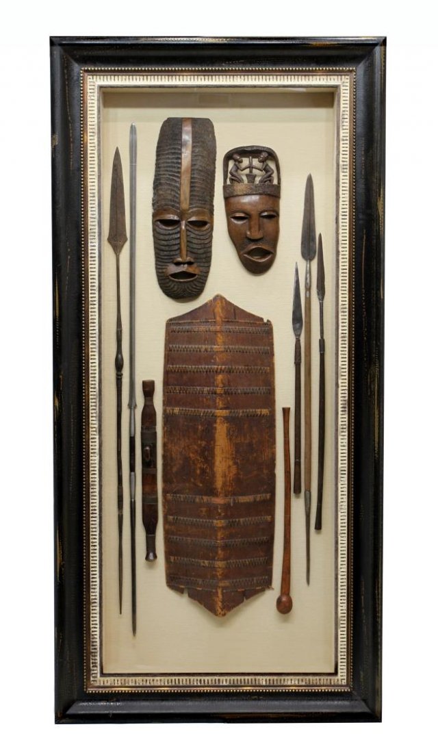 LARGE DISPLAY , AFRICAN MASKS, SPEARS, SHIELD, 92": Large high quality custom made shadow box display of African tribal antique martial items including five spears, the largest approx. 72"l, two carved wood masks, a wood shield about 45"h, a club, shad