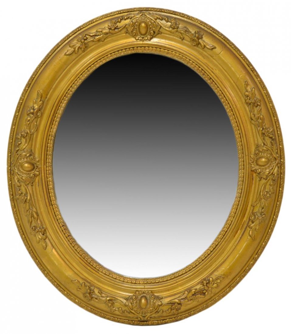 ANTIQUE SPAIN OVAL GILTWOOD FLORAL WALL MIRROR: Continental floral and foliate giltwood wall mirror, Spain, c.1900, oval form enclosing a flat mirror plate, retaining tag 'Cristal Alicante', approx 28.25"h, 32"w, 8lbs Start Price: $150.00