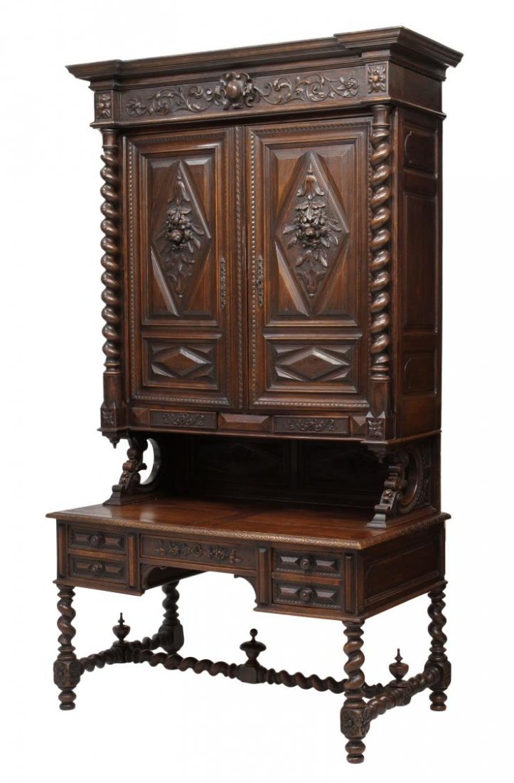 FRENCH RENAISSANCE REVIVAL BOOKCASE / WRITING DESK: French Renaissance Revival oak bookcase surmounting a conforming writing desk, late 19th c., a stepped cornice over twist columns and supports flanking the upper two door cabinet and lower four drawer