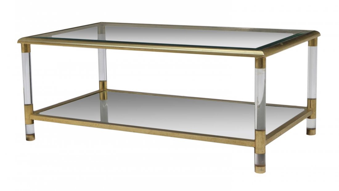 ITALIAN MID-CENTURY TWO-TIERED GLASS COFFEE TABLE: Italian mid-century two-tiered coffee table, a rectangular glass top and mirror undertray, raised on four plexiglass tubular supports with gilt metal cuffs and frame, surface wear, 16"h, 39.25"w, 21.5