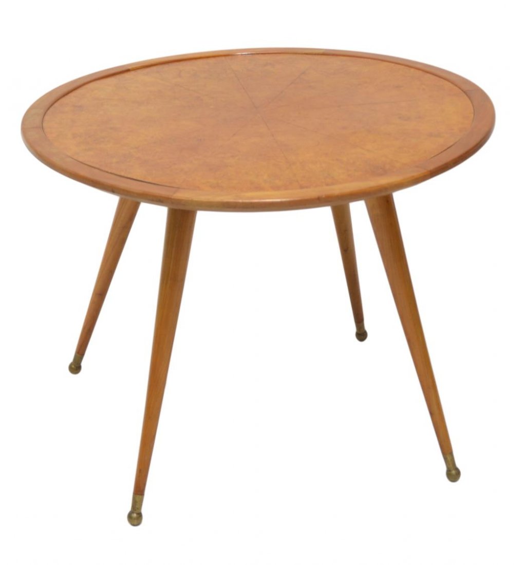 ITALIAN MID-CENTURY MODERN SIDE TABLE, GIORDANI: Italian mid-century modern occasional table, design by Pierluigi Giordani (20th c.), the circular top veneered in a wedge pattern, rising on four tapered turned supports terminating in brass caps, min