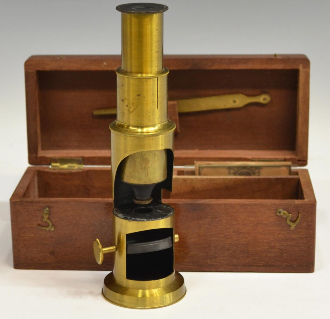 DIMINUTIVE BRASS FIELD MICROSCOPE: Diminutive cylindrical brass field microscope, earl 20th housed within a mahogany box with glass slides and tweezers, box: 2.25"h, 6.5/8"w, 2.5"d, 1lb Start Price: $50.00