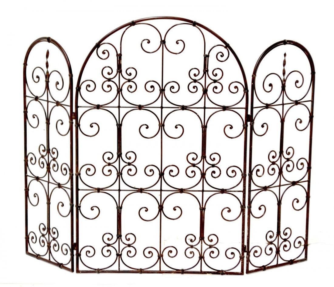 SPAIN THREE PANEL SCROLLED IRON FIRE SCREEN: Spanish iron folding fire screen, three hinged panels with pierced scrolls, 34.25"h, 44.5"w, 14lbs Start Price: $50.00