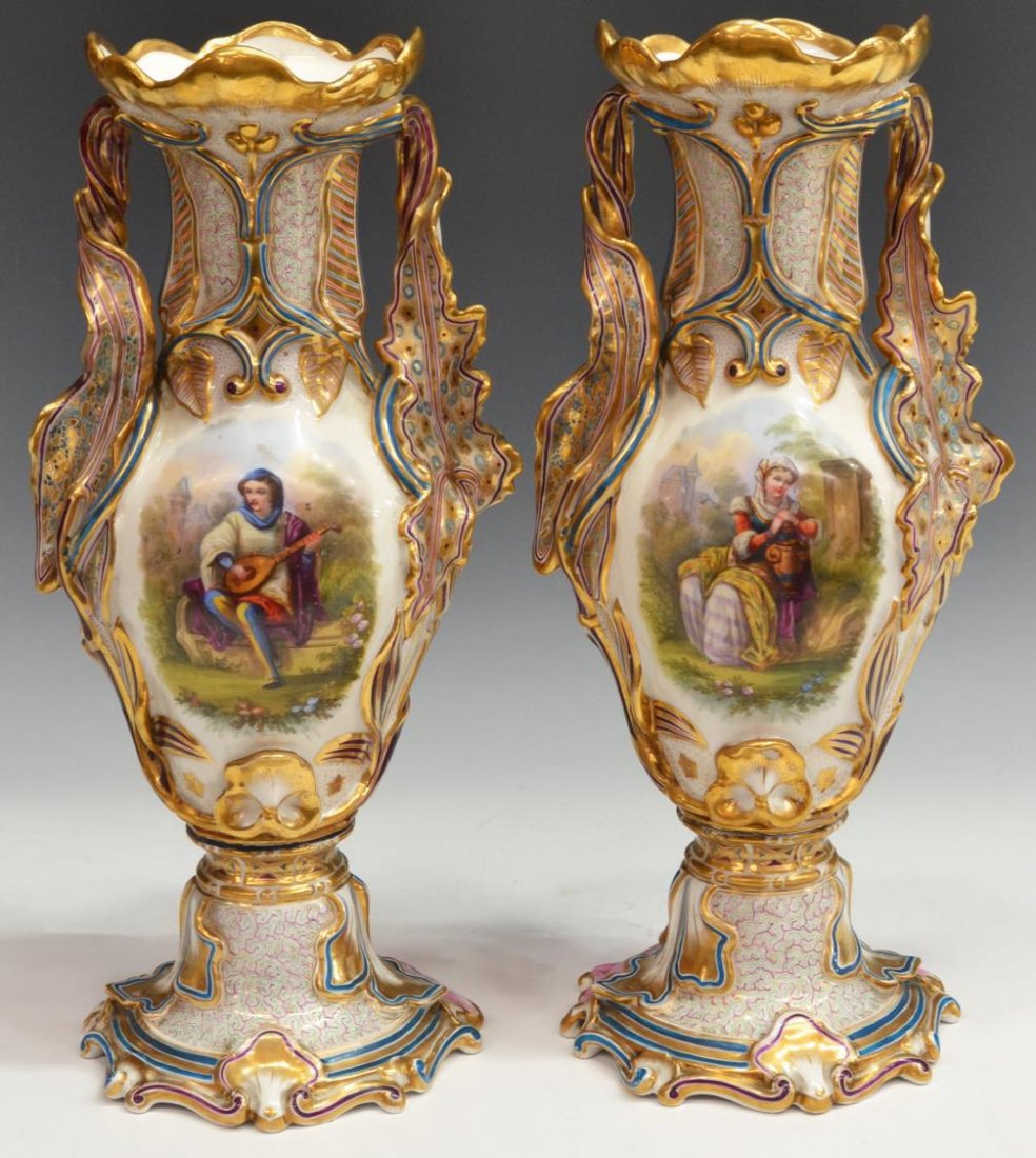 (2) 19TH C. OLD PARIS PARCEL GILT PORCELAIN VASES: (pair) Very fine Old Paris painted porcelain bolted urns, 19th c., central hand painted figural reserves of a maiden holding an urn and a man playing a mandolin, enclosed by gilt foliage and reserves