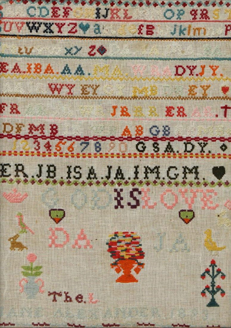 NEEDLEWORK SAMPLER, JANE ALEXANDER 1893: Framed needlework sampler by Jane Alexander, 1893, presented under glass in an oak frame, embroidered decoration of upper and lower case letters of the alphabet, numbers, trees, birds and other animal