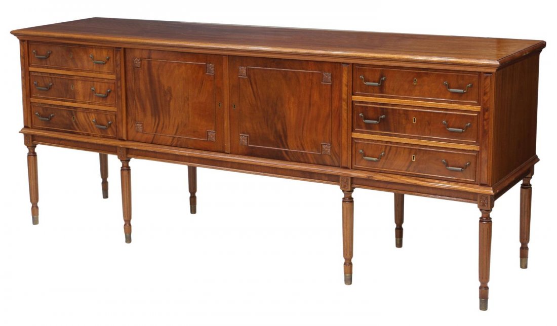 BRITISH CARVED MAHOGANY SIDEBOARD: British mahogany sideboard, 20th c., the case of rectangular form, set wtih two central doors and three drawers, on ribbed legs terminating in metal caps, 35.25"h, 86"w, 21.75"d Start Price: $300.00