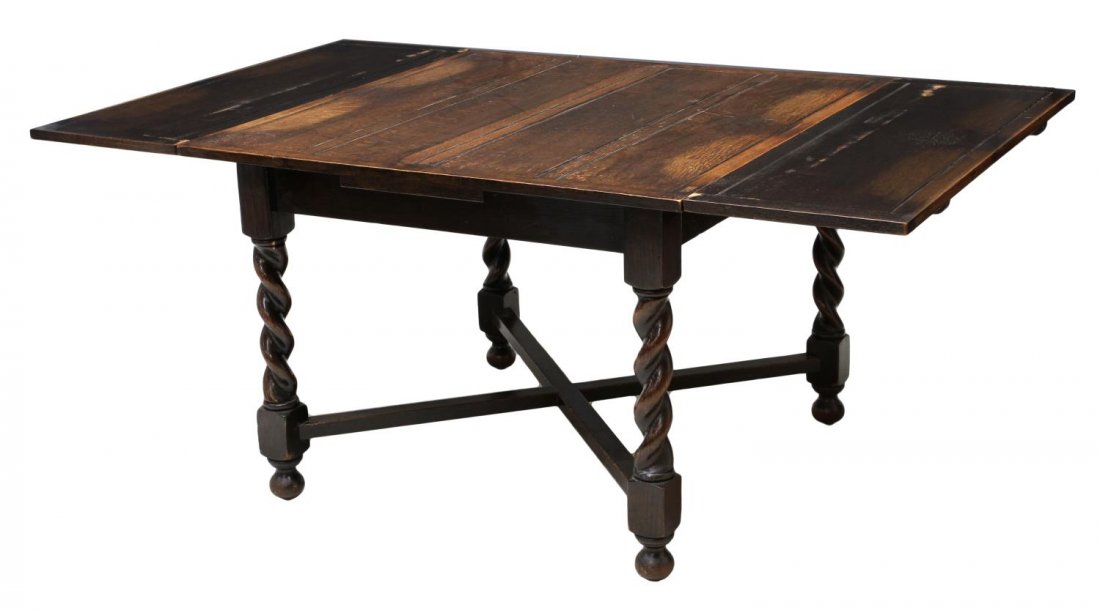 ENGLISH PANELED OAK TWIST LEG DRAW LEAF TABLE: English oak draw leaf pub or dining table, 20th c., having a paneled top, on four stretcher joined spiral legs, ball feet: leaves open: 71.75"l, leaves closed: 30"h, 41.75"l, 42"d Start Price: $250.00