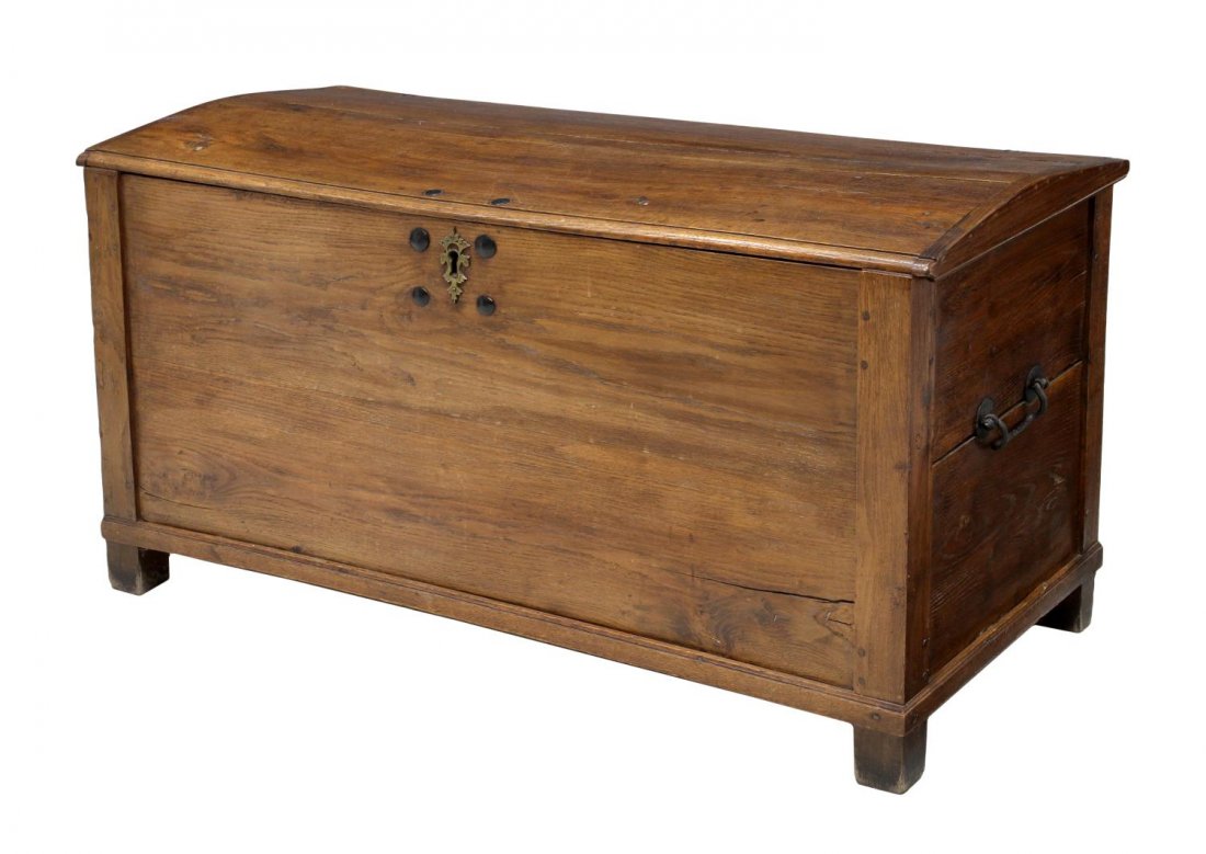 ANTIQUE OAK TRUNK: Antique oak trunk, 19th c., a moderate dome top held by iron strap hinges opens to the interior storage with lidded storage box and original lock, iron carry handles, block feet, 25.75"h, 49.25"w, 21.