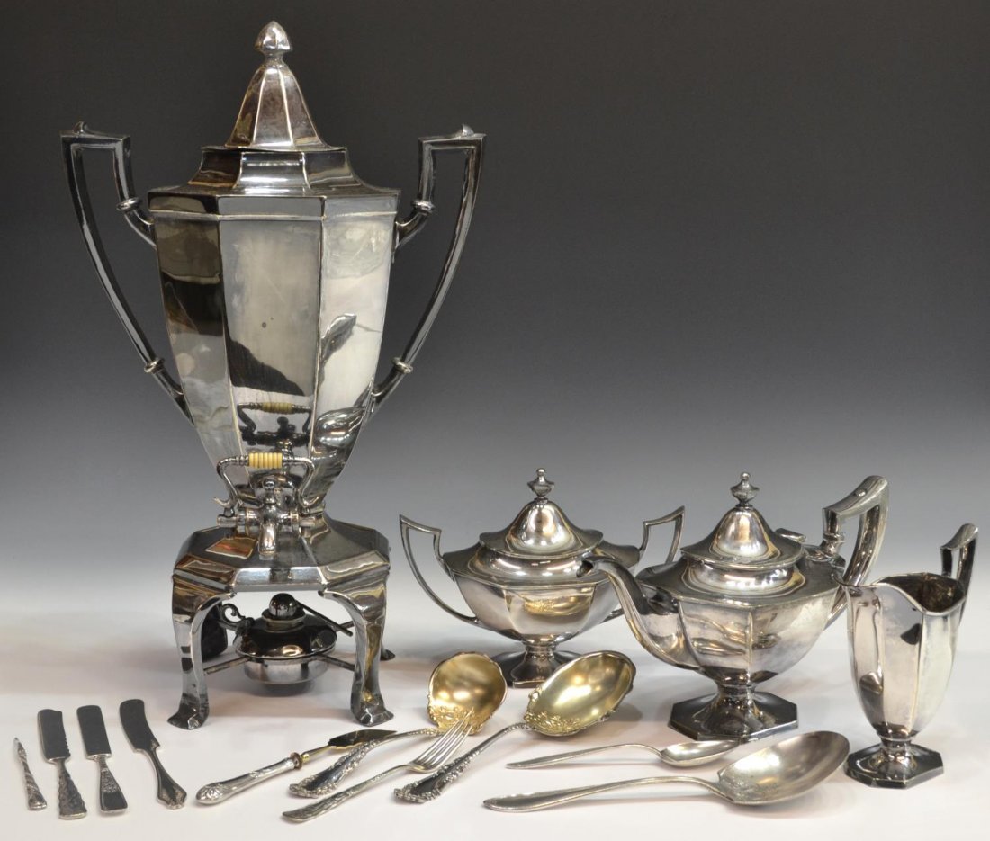 (14) HOMAN SILVERPLATE TEA SERVICE & FLATWARE: (lot of 14) Collection of silver plate serviceware: (4pc) American tea service, Homan Mfg. Co, paneled motif, comprising (1) hot water urn, 19"h, (1) kettle, 7.25"h, (1) lidded sugar, 6.5"h, (1) cream