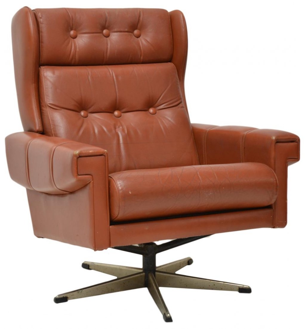 DANISH MODERN SWIVEL LEATHER ARM CHAIR: Danish modern arm chair, Lystolet, Lystager Industries, c. 1970, reddish brown buttoned leather with removable head, back and seat cushions, set on a chrome steel swivel base, 37"h, 30"w, 33"d Start P
