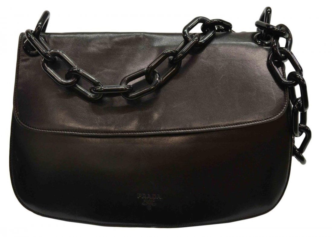 PRADA BLACK LEATHER SHOULDER BAG, LINK HANDLE: Prada black leather shoulder bag, plastic chain handle, of rectangular form, opening to two compartments with pocket, logo lined interior, accompanied by authenticity certificate card from Prada Monte