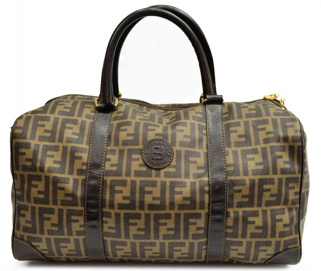 VINTAGE FENDI MONOGRAMMED CANVAS TRAVEL BAG: Vintage Fendi monogram canvas travel bag, natural leather handles, zipper closure, single pocket interior, bag: approx 9.25"h (not including handle), 14"w , 8.5"d Start Price: $150.00