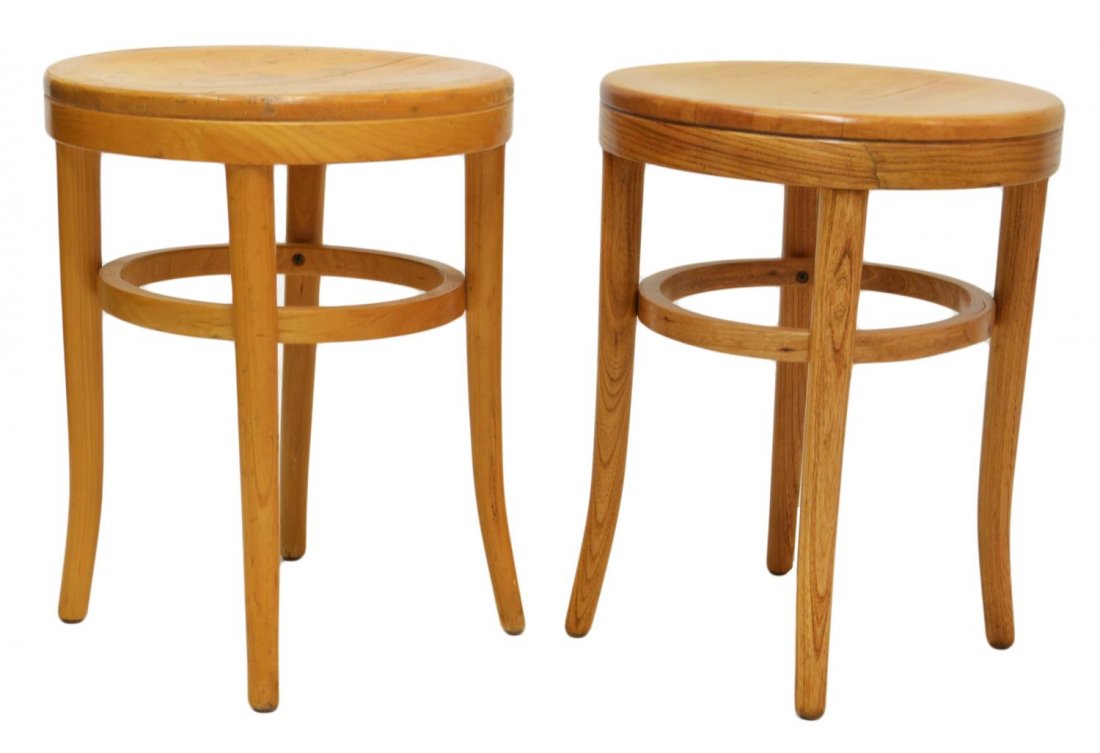 (PAIR) THONET MID-CENTURY MODERN BENTWOOD STOOLS: (pair) Thonet mid-century modern bentwood stools, circular seat raised on four tapered legs, marked underfoot, one with veneer loss to top, 18.25"h, 14.25"diam Start Price: $60.00