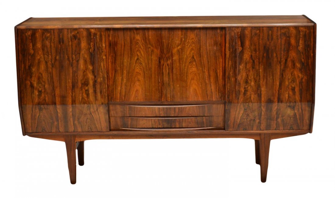 DANISH MID-CENTURY MODERN ROSEWOOD BAR SIDEBOARD: Danish mid-century modern rosewood sideboard, c. 1960, a slant front with four sliding doors, the center section with six drawers and mirrored bar area, tapered squared legs, several ring stains to to