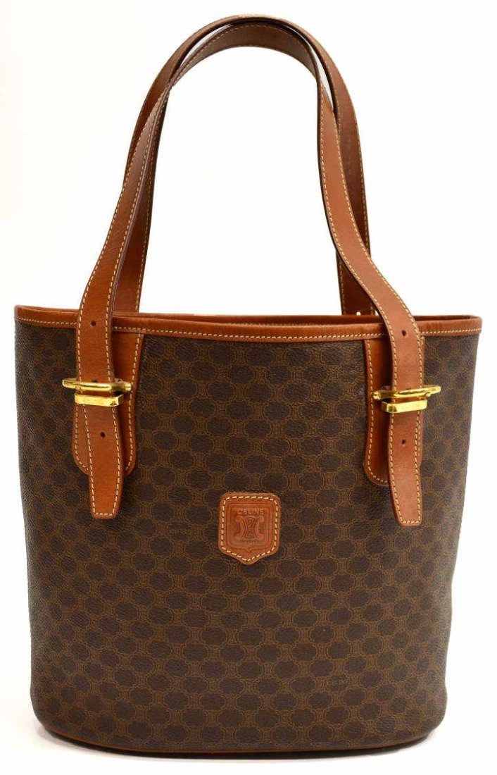 CELINE BROWN CANVAS & LEATHER SHOULDER BAG: Celine brown canvas shoulder bag with adjustable leather handles, gold hardware, central interior zippered pocket, set on four metal feet, shoulder bag: approx. 9.75"h, 13"w, 5"d, 1.25lbs Start Price: