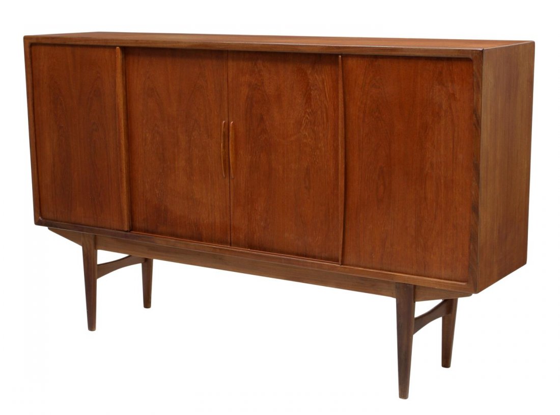DANISH MID-CENTURY MODERN TEAKWOOD SIDEBOARD: Danish mid-century modern teakwood sideboard, c. 1960, four sliding doors opening to a mirrored bar area, shelves and drawers, rising on tapered legs, 45.5"h, 75"l, 16.75"d Start Price: $400.00