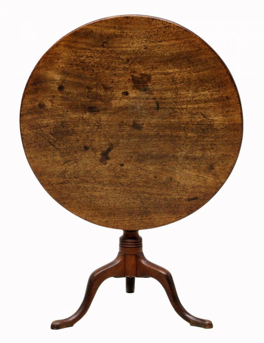 ANTIQUE MAHOGANY TILT TOP TABLE: Mahogany circular tilt top tea table, 19th c., rising on a turned central pedestal with three cabriolet snake foot legs, stains and scratches, top tilted up: 43.25"h, top down: 27.25"h, 30.5"diam *Pro