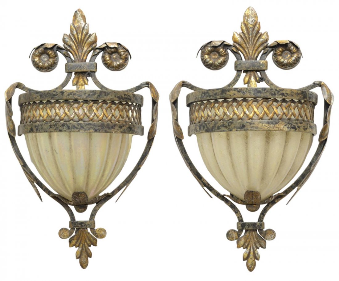 (PAIR) DESIGNER PARCEL GILT ONE-LIGHT WALL SCONCES: (pair) Designer parcel gilt iron one-light wall sconces, Fine Art Lamps, Miami Lakes, FL, a foliated frame with flower head accents having a pierced band, all supporting a painted and textured glass s