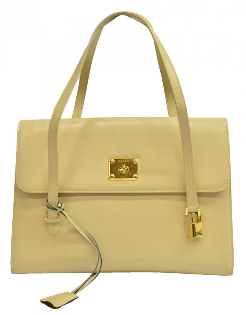 BALLY CREAM LEATHER SHOULDER BAG PURSE: Bally cream leather shoulder bag, gilt metal hardware and lock with key, three interior sections having zipper and slot pockets, bag: approx 9"h, 11.75"w, 3.5"d, 1.5lbs Start Price: $100.00