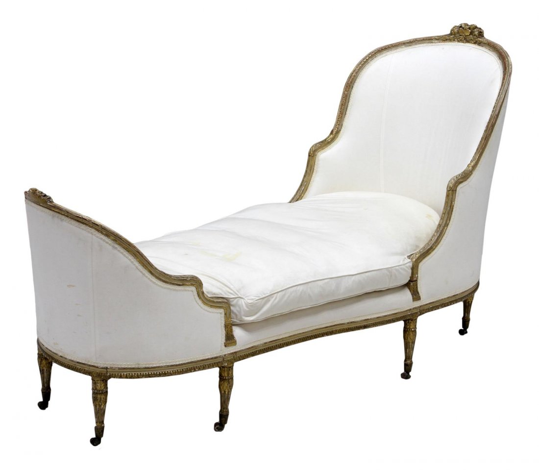 FRENCH LOUIS XVI STYLE GILTWOOD CHAISE LOUNGE: French carved Louis XVI style giltwood framed chaise lounge, early 20th c., the curved backs with foliate carved crest, loose down cushion, tapered fluted legs, stains, 44"h, 72"l, 28"d *Provenance: F