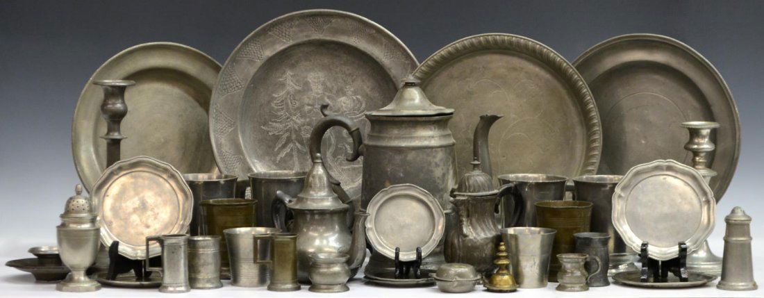 COLLECTION OF ANTIQUE PEWTER CABINET ITEMS: (lot) Collection of antique pewter cabinet items, highlights include charger with figural and landscape scene, plates, tea pots, candlesticks, covered pitcher, mugs, tankards, salt and pepper shakers,
