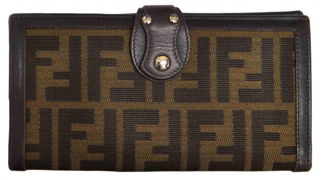 FENDI MONOGRAM CANVAS LONG WALLET: Fendi monogram canvas long wallet, one side with snap closure opening to card and bill holders, the other side with a coin compartment, retaining certificate of authenticity on interior tag, stamped m