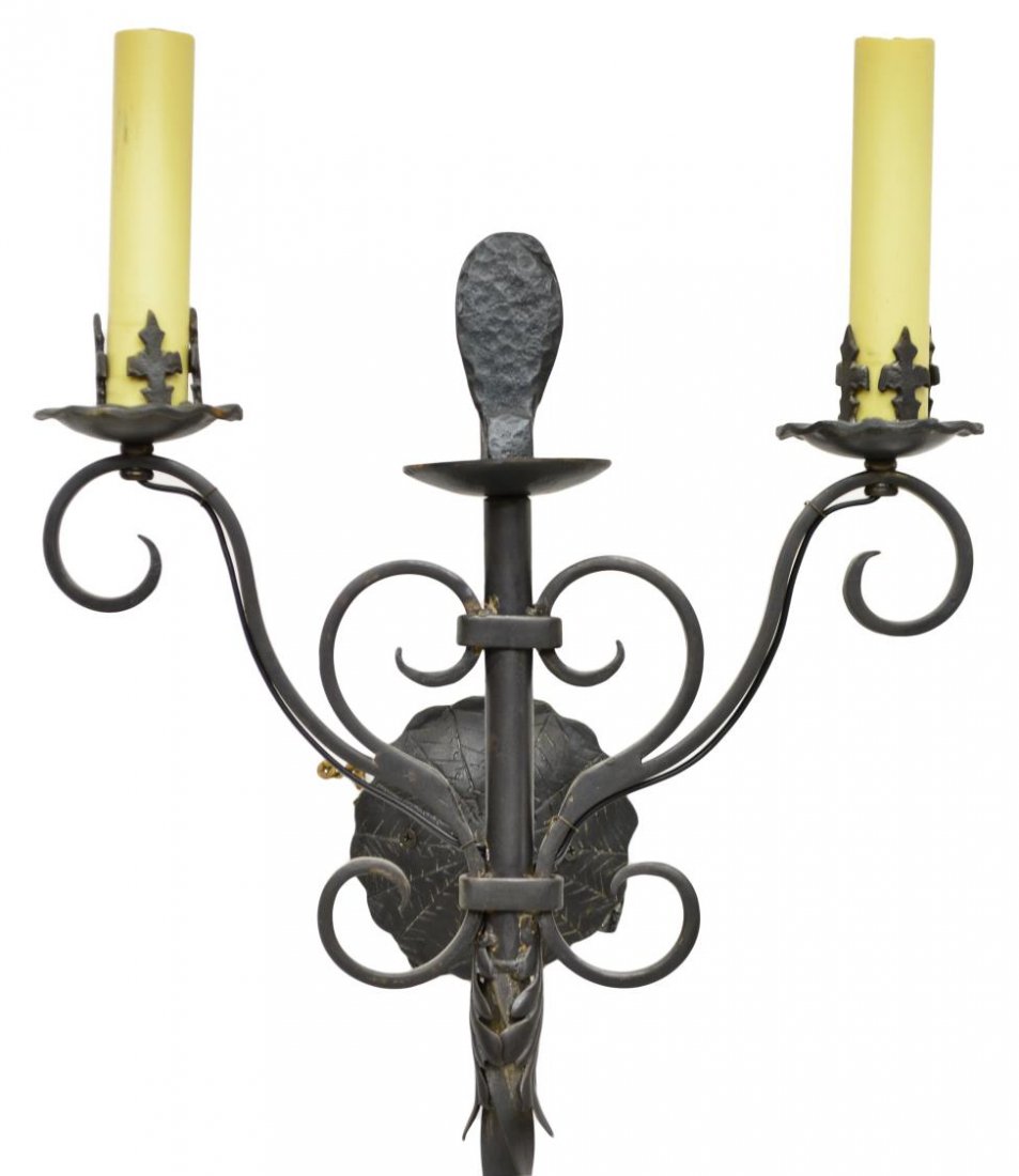 DESIGNER WROUGHT IRON TWO-LIGHT WALL MOUNT LIGHT: Designer Gothic style wrought iron two-light wall mount light, 20th Century Lighting, two lights rising on a twisted standard, scrolled and foliate accents, retaining designer tag on the backside, app