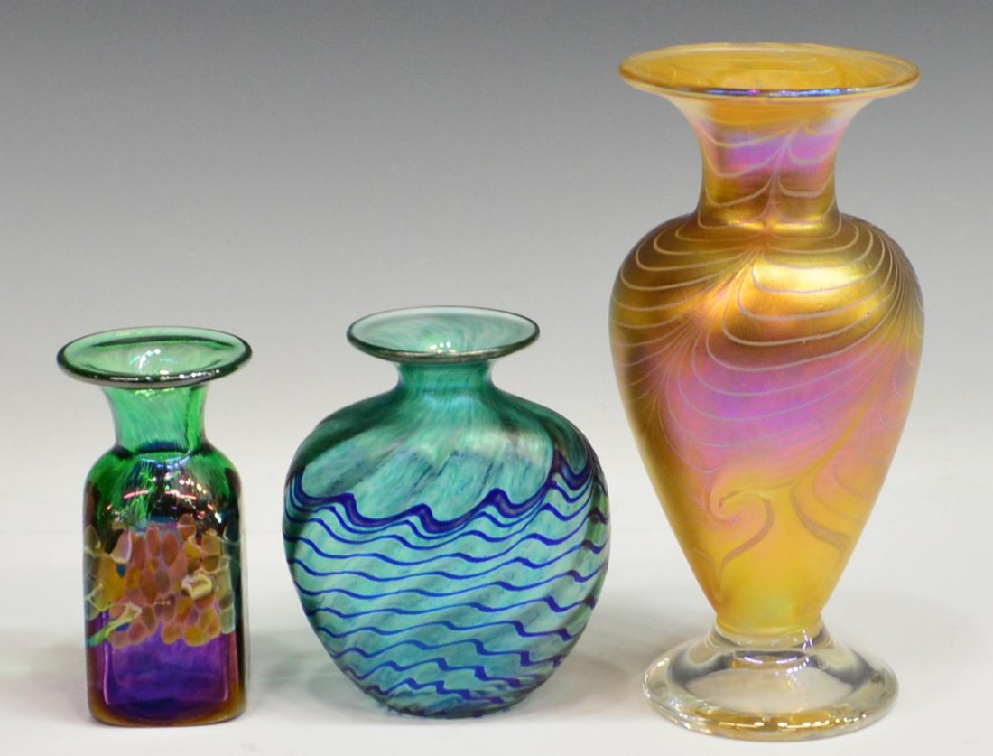 (3) COLLECTON OF ROBERT HELD ART GLASS VASES: (lot of 3) Group of iridescent art glass vases, by Robert Held (American, 20th/21st c.), comprising: (1) vase of baluster form, pulled feather pattern on a yellow toned ground, clear glass base, acid 