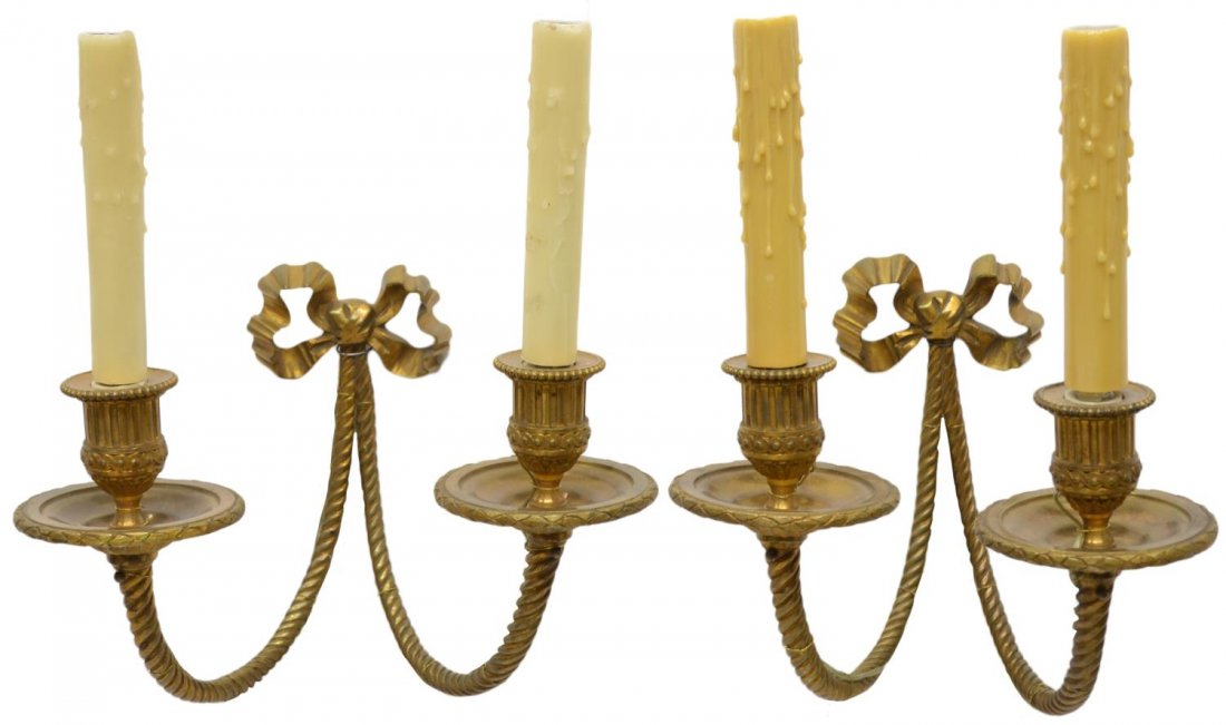 (PAIR) LOUIS XVI STYLE GILT BRONZE LIGHT SCONCES: (pair) Louis XVI style gilt bronze wall sconces, the bow back plate issuing dual spiral arms terminating in ribbed and scrolled cups holding lights, wired, approx 13.5"h, 11.25"w, 7.5"d, 9.25lbs total