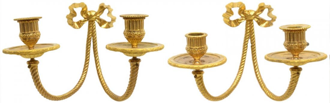 (PAIR) LOUIS XVI STYLE GILT BRONZE CANDLE SCONCES: (pair) Louis XVI style gilt bronze wall sconces, the bow back plate issuing dual spiral arms terminating in ribbed and scrolled candle cups, approx 9.75"h, 11.5"w, 10"d, 8.5lbs total *Provenance: From