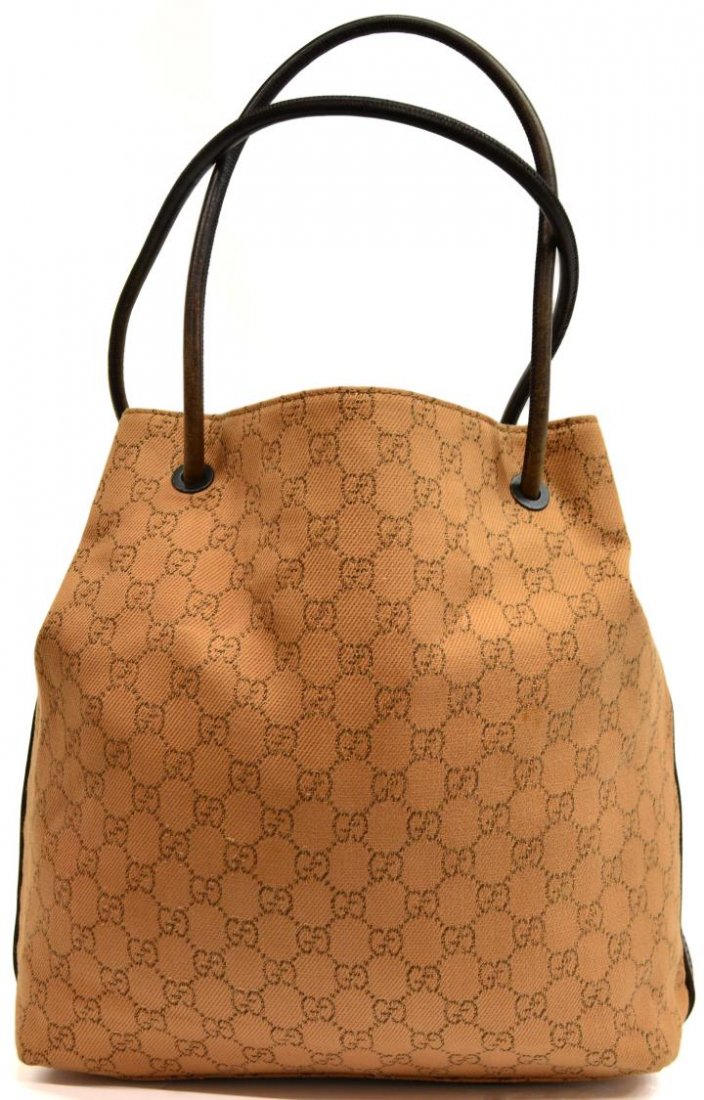 GUCCI MONOGRAM CANVAS SHOULDER BAG, TAN & BROWN: Gucci monogram canvas shoulder bag, in tan and brown tones, leather handles and trim, lined interior with single zipper pocket, Made In Italy, bag: approx 13"h, 15"w, 3.75"d, 1lb Start Price: $150.00