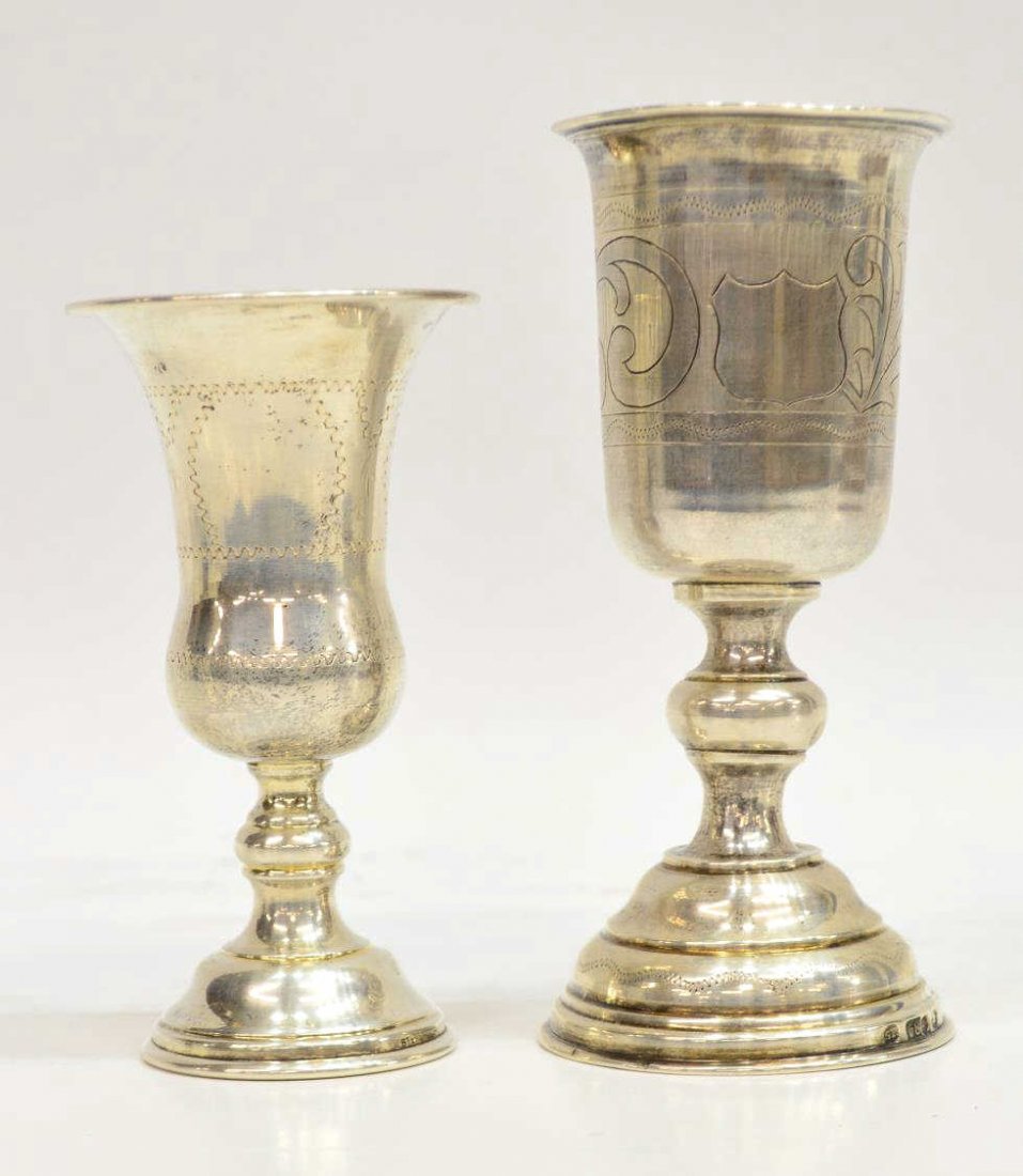 (2) RUSSIAN 84 SILVER STANDARD & STERLING CHALICES: (pair) Silver chalices: (1) Russian example, St. Petersburg, the engraved bowl with central cartouche, rising on a domed foot, obscured Russian 84 zolotnik and makers hallmarks, 6"h; (1) having flared