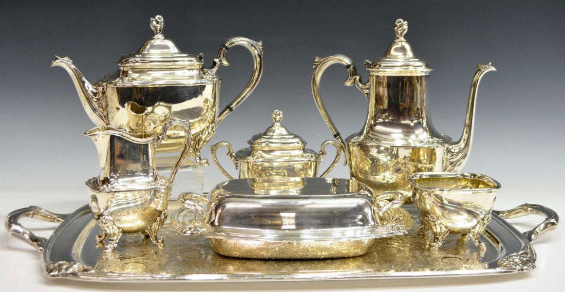 (7) AMERICAN 'DAFFODIL' SILVERPLATE COFFEE SERVICE: (set of 7) American silver plate tea and coffee service, 1847 Rogers Bros., in the 'Daffodil' pattern, comprising: (1) large handled service tray, 27"w, 17"d; (1) coffee pot, 11"h; (1) teapot, 8.25"h;