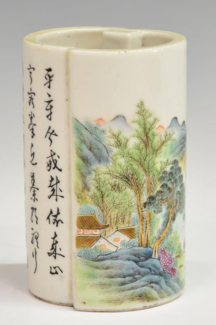 CHINESE REPUBLIC PERIOD PORCELAIN BRUSH HOLDER: Chinese enameled porcelain brush holder, Republic period, fashioned as a partially unfurled scroll with a colorful landscape juxtaposed by a long calligraphic inscription, the base with four-character