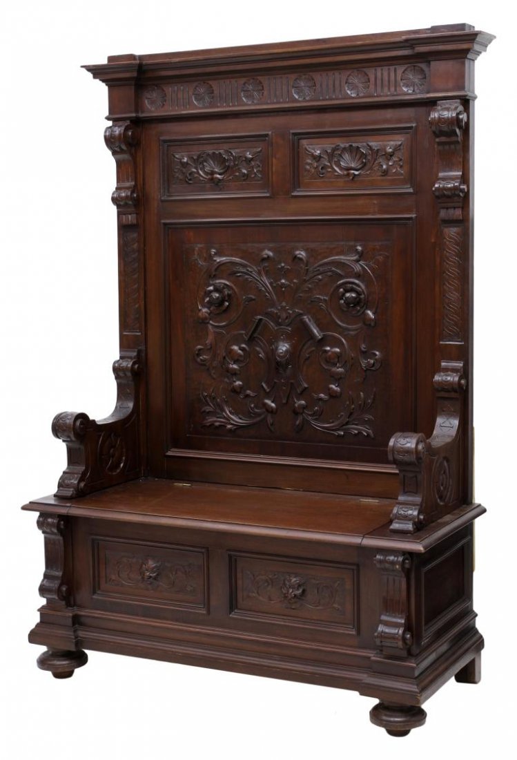 ITALIAN RENAISSANCE REVIVAL HALL BENCH: Italian Renaissance Revival hall bench, late 19th c., the high back with stepped cornice over geometric, foliate and shell carved panels, the hinged seat opening to storage, rising on bun feet, 71.5"h