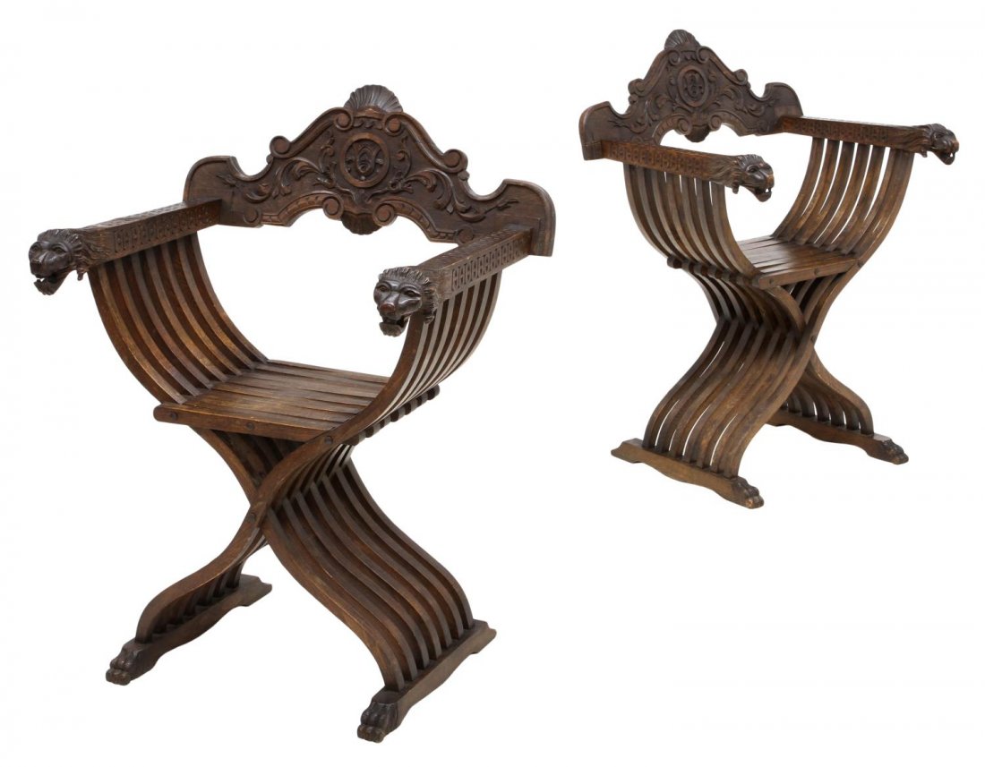 (PAIR) ITALIAN SAVONAROLA LIONS HEAD CHAIRS: (pair) Italian Savonarola cross framed or X frame chairs, 20th c., foliate and geometric carvings at back, arms terminating in lions heads, claw foot legs, 36.5"h, 26"w, 19"d Start Price: $200.00